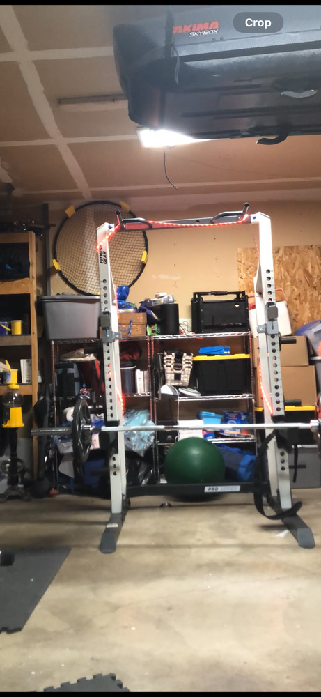 Fitness Gear squat rack with 300 lbs of weights, Olympic lifting bar, and bench