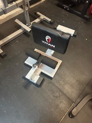 White and Black titan fitness sissy squat brace (used in home gym only)
