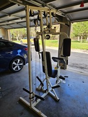 Universal gym equipment used with 175 lb of weights
